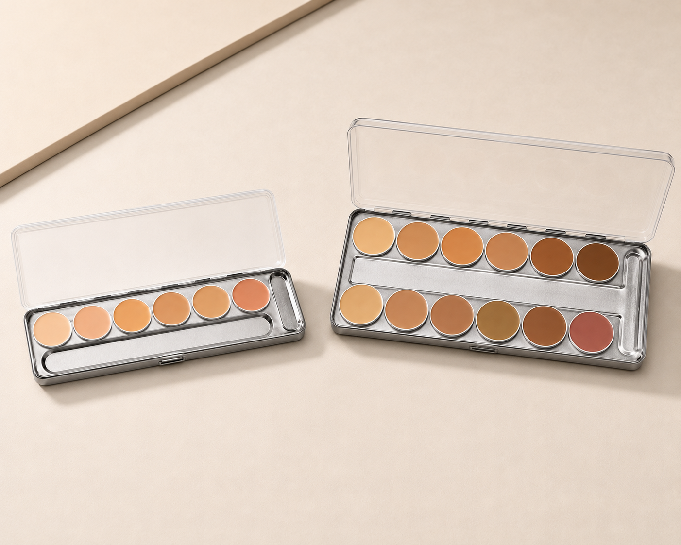 Six-shade and twelve-shade Dermacolor palettes side by side